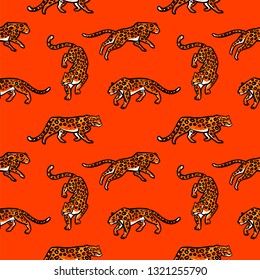 Seamless pattern. Leopards are isolated on an orange background. Cute illustration of a wild cats.