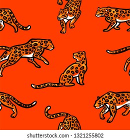 Seamless pattern. Leopards are isolated on an orange background.