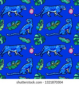 Seamless pattern. Leopards in the tropics. A rainforest. Monstera leaves. Isolated on an blue background.