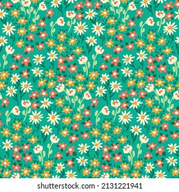 Seamless pattern with liberty flowering meadow. Romantic floral print with small flowers, leaves. Artistic botanical background with a field of hand drawn plants. Vector illustration.