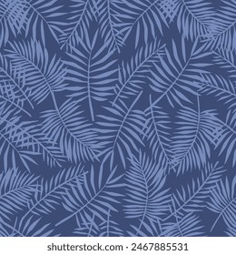 Seamless pattern of light blue leafs on a dark blue background. Presented through a scattered positioning of leafs. The pattern is ideal for printing on fabric, textiles and paper products.