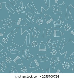 Seamless pattern of line art winter clothes. White sweater, mittens, hat, socks and snowflakes on blue background. Doodle style. Vector illustration