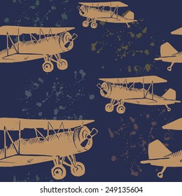 Seamless pattern with linocut vintage airplanes and ink drops