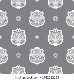 Seamless pattern with a lion's head in a simple style. Good wall wallpaper, fabric, postcards and printing. Vector 