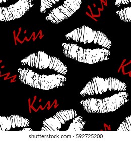 Seamless pattern with lips and text "kiss".