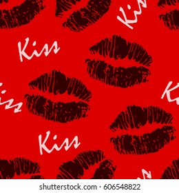 Seamless pattern with lips and text "kiss".