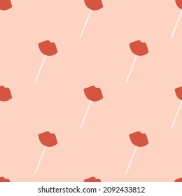 Seamless pattern with lip-shaped lollipops