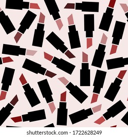 Seamless pattern with lipsticks of different colors on a pink background. Suitable for use in beauty salons.
