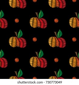 Seamless pattern with little apple embroidery stitches imitation. Apple embroidery pattern on black background.