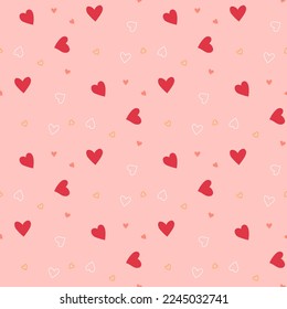 seamless pattern with little chaotic hearts on pink background