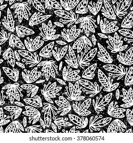 Seamless pattern of a little different flowers.Elegant seamless pattern with classic tracery on a white background. Vintage style.Seamless floral doodle background pattern in vector.