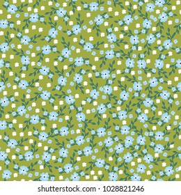Seamless pattern with little flowers . Forget-me-nots on a green background. For tissue paper. Vector print.