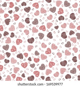 Seamless pattern with little hearts on a white background