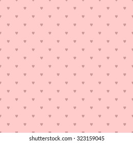 Seamless pattern with little hearts in the style of polka dot on a gentle background light peach-beige