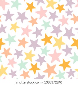 Seamless pattern with little multicolored stars on white background.