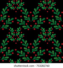 Seamless pattern with little spruce branches and red berries embroidery stitches imitation on the black background. Fashion holiday embroidery.