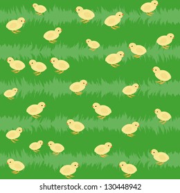 Seamless pattern with little yellow chickens on the grass