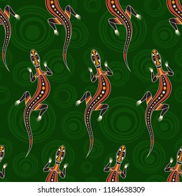 Seamless pattern of lizards with abstract circles on background. Australian art. Aboriginal painting style. Vector color background.