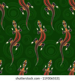 Seamless pattern of lizards with abstract circles on background. Australian art. Aboriginal painting style. Vector color background.