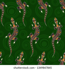 Seamless pattern of lizards with abstract circles on background. Australian art. Aboriginal painting style. Vector color background.