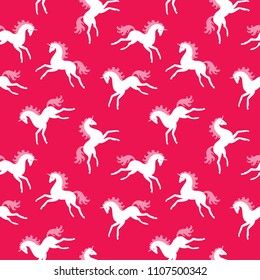 Seamless pattern. Lovely unicorns on a pink background. Fairy animals. Children's print.