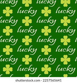 Seamless pattern of lucky words and shamrock leaves on isolated green background. Design for St. Patrick’s day celebration, party decoration, scrapbooking, home decor, textile, print, paper crafts.