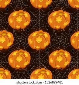 Seamless pattern with luminous pumpkin and cobwebs