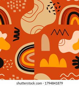 Seamless pattern made from creative freehand spots, lines and dots. Drawn textures in autumnal, fiery, warm colors. Vector seamless background pattern with cut out abstract shapes. Vector trend