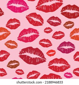 Seamless pattern made up of different red colored female lips for package, wrapping paper, cloth, cards, wallpaper, background or envelopes. Endless pattern of a lot of lipstick female prints.