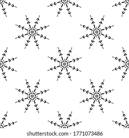 Seamless pattern made from doodle abstract snowflakes. Isolated on white background. Vector stock illustration.