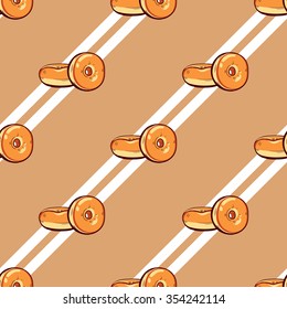 Seamless pattern made from hand drawn donuts and white stripes. Vector illustration for cafe or bakeries.