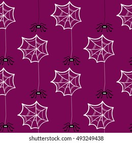 Seamless pattern made from hand drawn spiderwebs and spiders. Vector illustration. Can be used for wrapping or wallpaper or in textile.