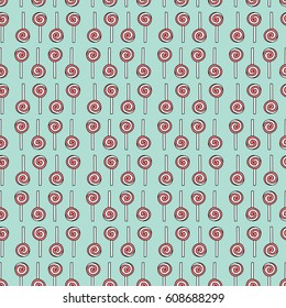 Seamless pattern made of illustrated lollipops on turquoise