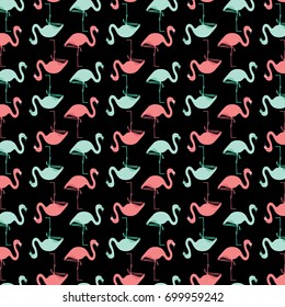 Seamless pattern made of illustrated pink and turquoise flamingos on black