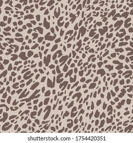 Seamless pattern made of leopard spots skin texture. African animal fur background. Spotted ornament. Vintage style. Good for wrapping, banner, fashion, textile and fabric.