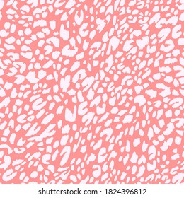 Seamless pattern made of leopard spots skin texture. African animal fur background. Spotted ornament. Vintage style. Good for wrapping, banner, fashion, textile and fabric.