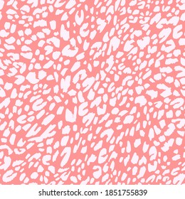 Seamless pattern made of leopard spots skin texture. African animal fur background. Spotted ornament. Vintage style. Good for wrapping, banner, fashion, textile and fabric.