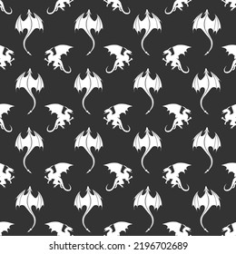 Seamless pattern made up of white dragons and wyverns on the black background. Endless repeating pattern for printing on package, wrappers, textile, envelopes, cards or cloth.