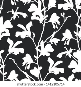 Seamless pattern with magnolia tree blossom in black and white. Floral background with branch and magnolia flower. Spring design with big floral outline elements. Hand drawn botanical illustration.