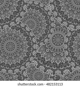 Seamless pattern mandala ornament. Vintage decorative elements. Hand drawn oriental background. Tribal motifs.