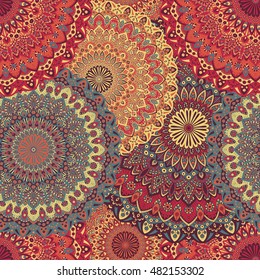 Seamless pattern mandala ornament. Vintage decorative elements. Hand drawn oriental background. Tribal motifs.