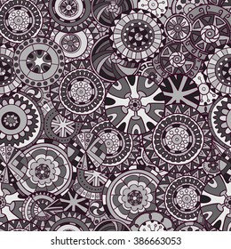 Seamless pattern of mandalas in black and white tones. Vector graphics.