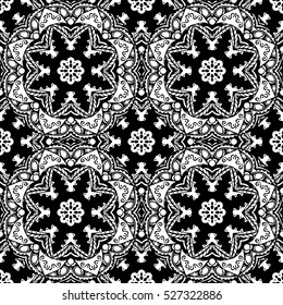 Seamless pattern with mandalas in black and white colors. Vector background.