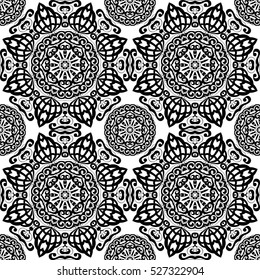Seamless pattern with mandalas in black and white colors. Vector background.