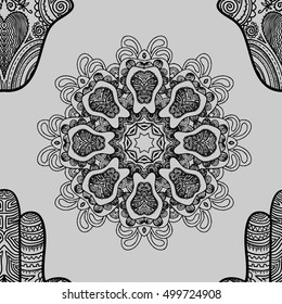 Seamless pattern with mandalas and hamsa. Vector ethnic ornament.