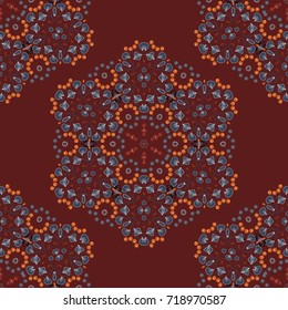 Seamless pattern with mandalas. Mystic background in blue, orange and brown colors. Vector textile print for bed linen, jacket, package design, fabric and fashion concepts.