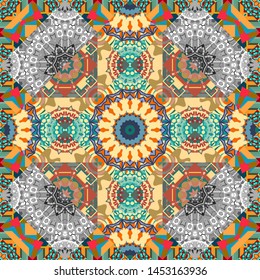 Seamless pattern from mandalas painted in gray, yellow and blue colors. Vector abstract geometric kaleidoscopic mandala design symbol - symmetric.
