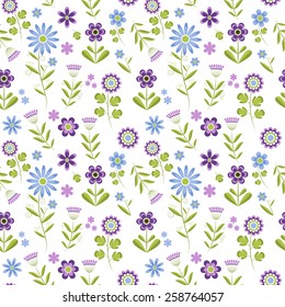 Seamless pattern.  Many blue and purple spring flowers  on white background