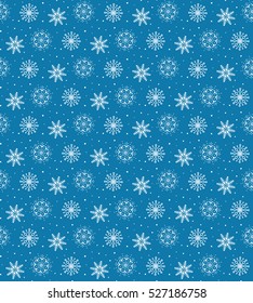 Seamless pattern of many white snowflakes on blue background. Christmas winter theme for gift wrapping. New Year seamless background for website