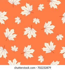 Seamless pattern with maple leaves on orange background. Autumn or fall season repeating print layout. Vector seasonal texture design for thanksgiving or harvest festival.